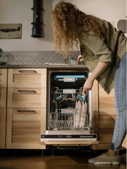 A partially loaded dishwater before a load