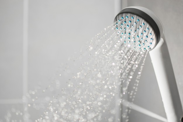 A shower faucet using an unlimited potential for hot water through a tankless water heater. 
