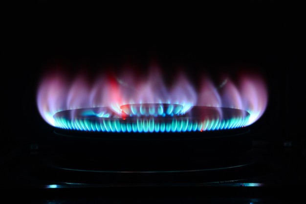 A gas burner used to power a water heater. Natural gas is often used in gas-powered water heaters.