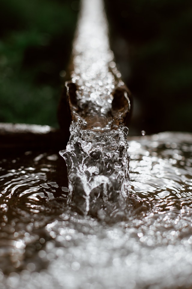 lead-contaminated water flowing out of a pipe