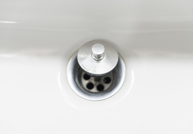 A clean shower drain stopper or strainer that keeps hair, soap scum, and other grime from flushing down the drain pipe. 