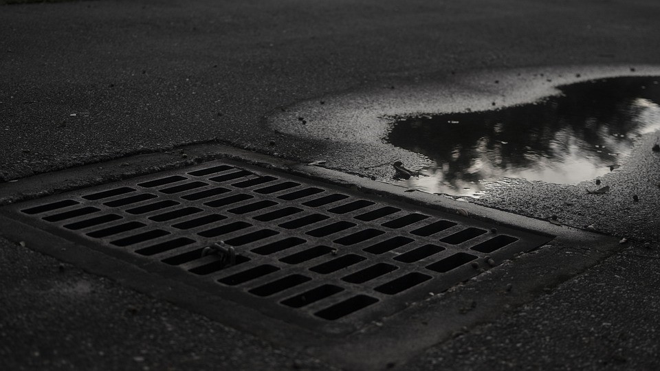 water draining into sewer