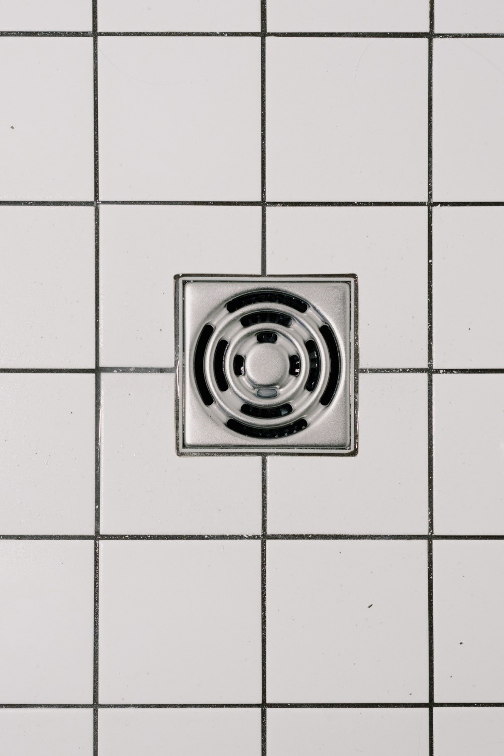 Floor drain installed in an older washroom Take Care of the Floor Drain Surroundings